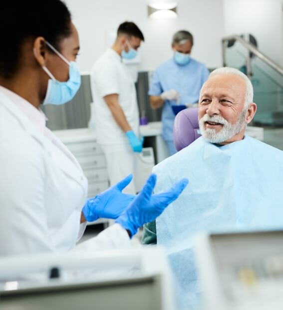 Dentist discussing treatment plan with dental patient