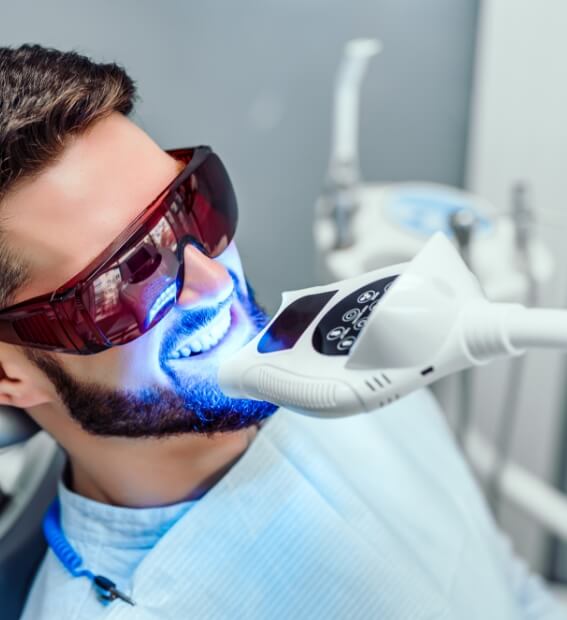 Dental patient receiving teeth whitening