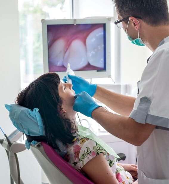 Dentist capturing smile images with intraoral camera