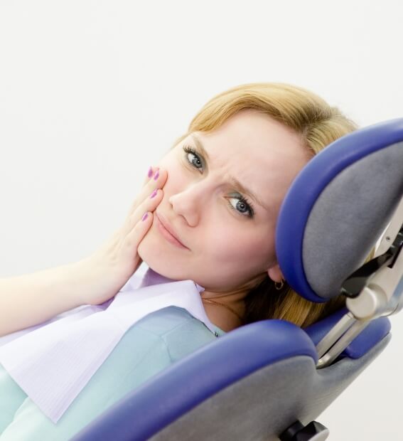 Woman in pain before emergency dentistry