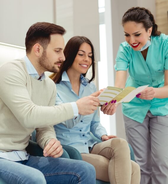 Dental team member discussing in network PPO dental insurance providers