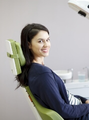 Woman smiling during preventive dentistry visit