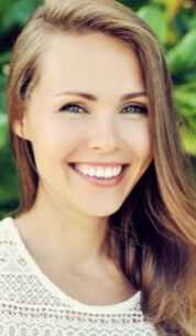 Woman with flawless smile after cosmetic dentistry