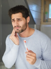 Man in pain before emergency dentistry