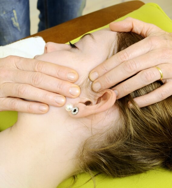 Dentist performing equilibration and occlusal adjustment treatment